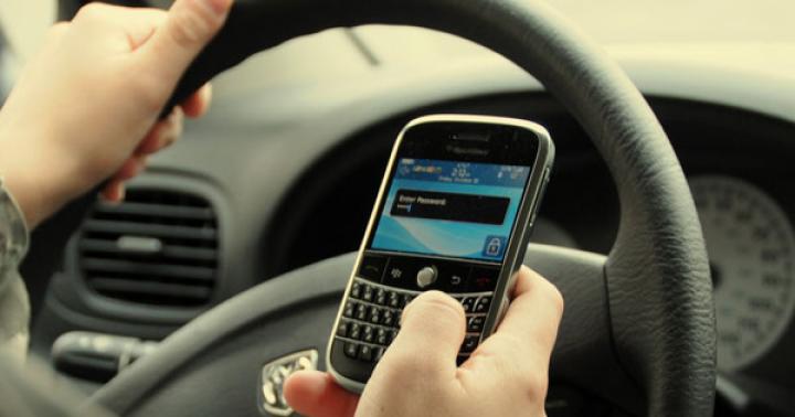 Why is a fine for using a cell phone while driving illegal?